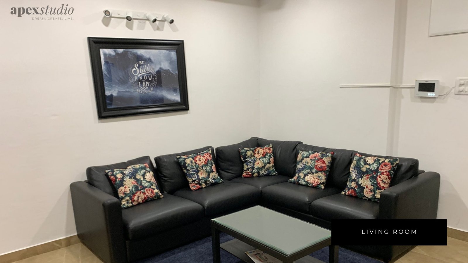 Living room corner sofa with floral cushions