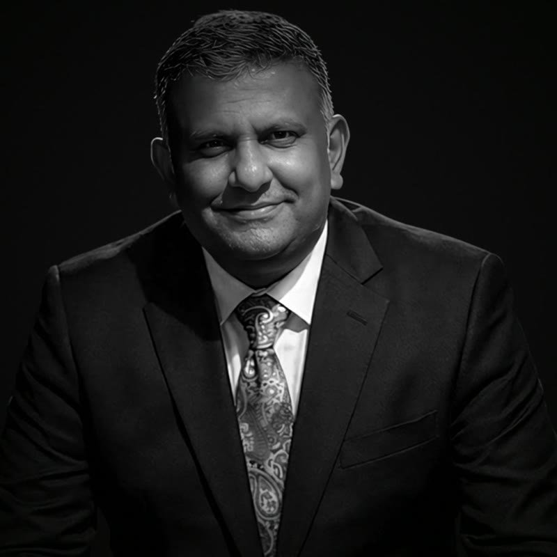 Joshua Paul Voola, Founder and Owner of ApexStudios, black and white portrait